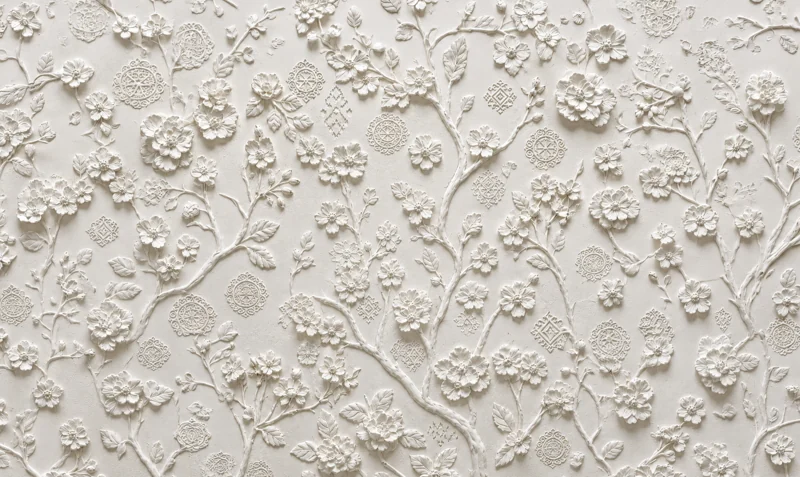 PARI signature bas-relief: a blossoming branch
